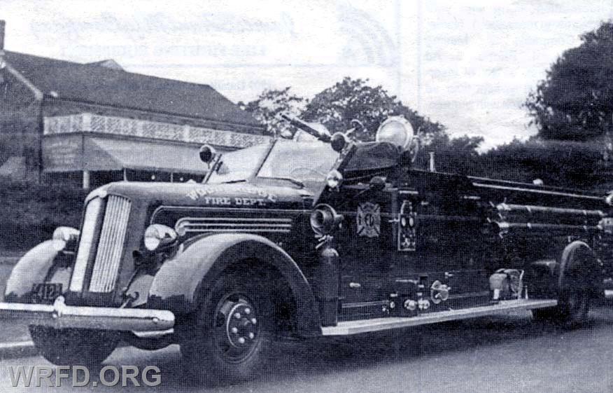1947 Seagrave ladder truck with a pump